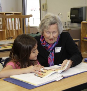Resident volunteer reading to student at Two Rock Element School through United Way Schools of Hope